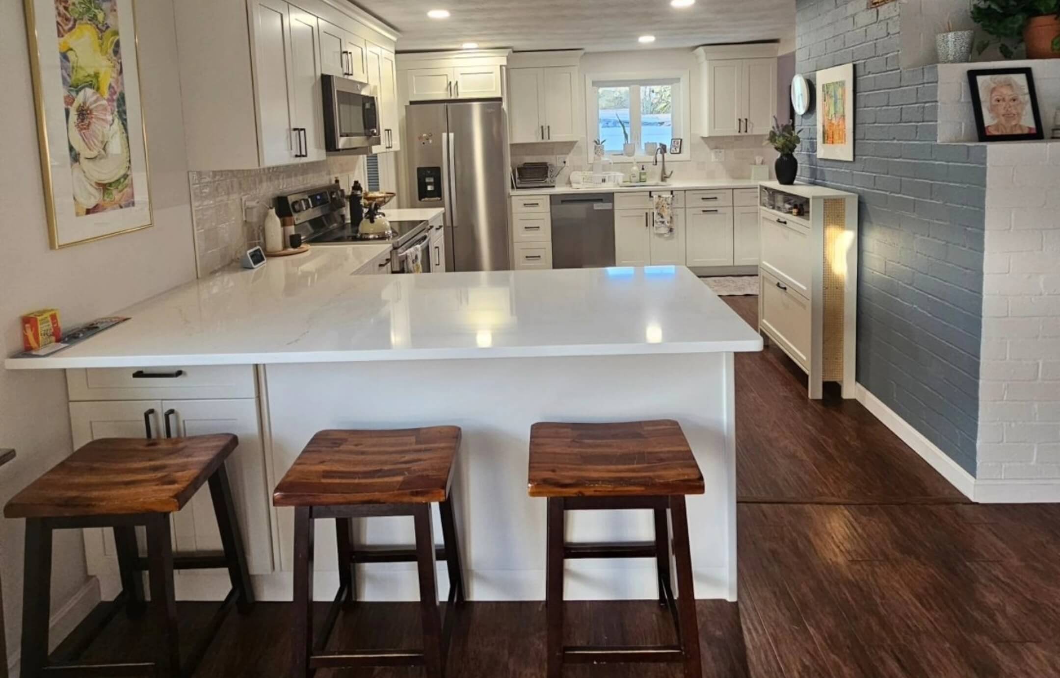 Modern kitchen remodeling Framingham with sleek countertops and white cabinetry
